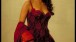 Elektra King (SOPHIE MARCEAU) in her red casino dress.