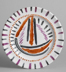 Plate with overglaze painted sailing boat design (attributed to Duncan Grant). The Omega Workshops.