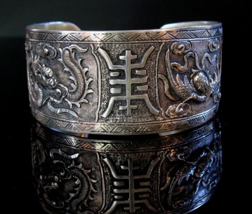 19th-century Chinese Carved Silver Four Ling Bracelet, carved with rich symbolism depicting thousands of years of Chinese cultural and spiritual traditions