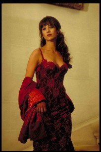 Elektra King (SOPHIE MARCEAU) in her red casino dress.