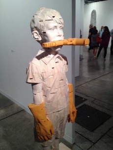 Gehard Demetz, Stones in my Pocket (2013), limewood & acrylic paint, 66x15.5x12.75 insPhoto: John Varoli, reproduced with permission