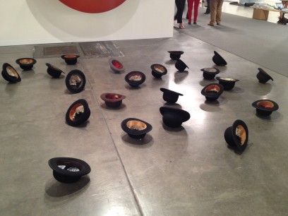 Latifa Echakhch, Mer d'Encre (2012), 24 bowlers, fibreglass, indian ink, dimensions variable. Photo: John Varoli, reproduced with permission