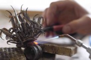 Noemi Klein at work on a ring specially designed for the exhibition. Photo: Museum of London