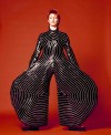 Bowie in striped body suit designed for the Alladdin Sane tour by Kansia Yamamoto. Photo: Masayoshi Sukita. The David Bowie Archive